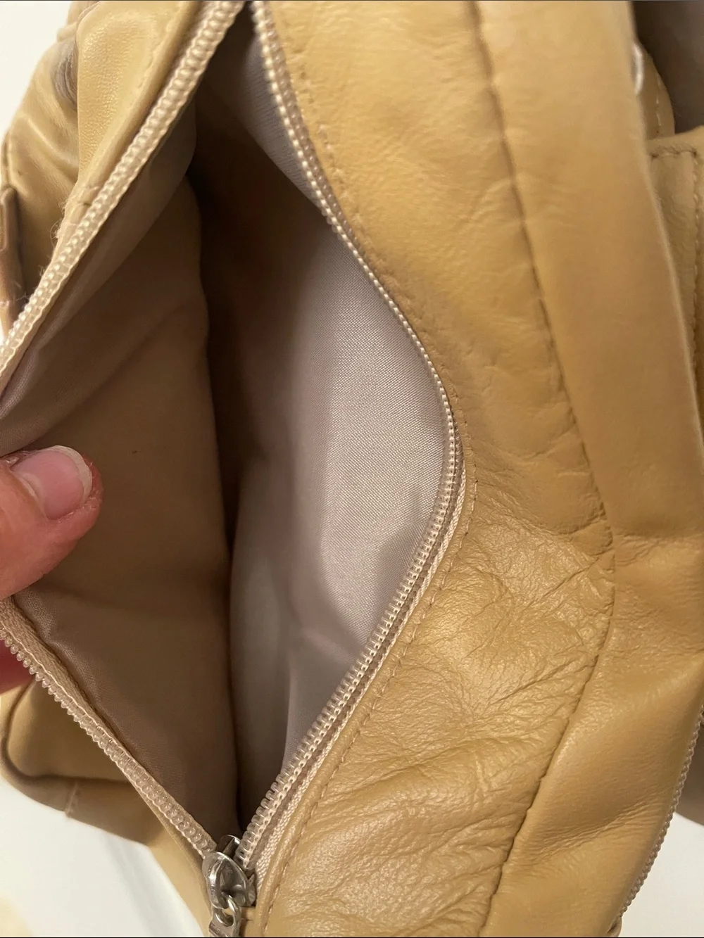 Buxton tan crossbody sling backpack
